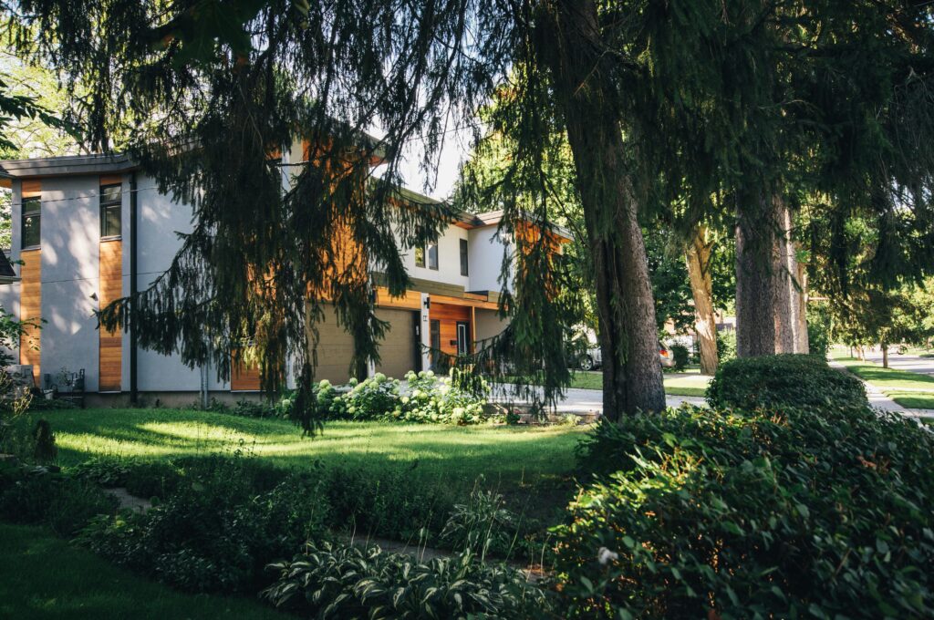 Photo of a secluded house nestled in the woods near Portland, OR. The house is surrounded by lush, dense greenery, with tall trees creating a serene and tranquil setting. This picturesque scene emphasizes a peaceful retreat and highlights the moving company's ability to handle relocations to unique, forested locations.